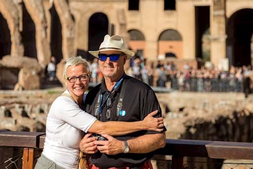 Beautiful couple taking a picture inside the Colosseum