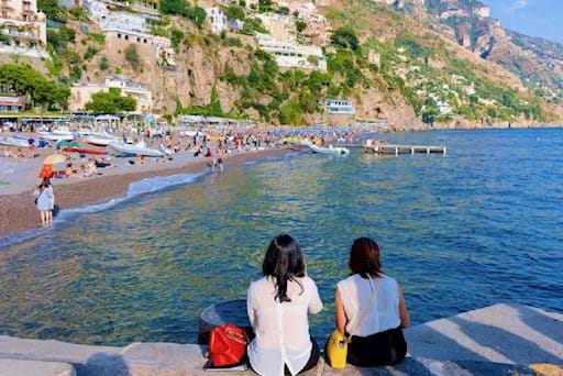 Tourists chilling at the Positano Beach
