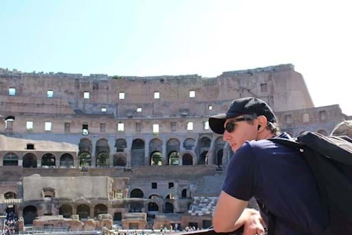 Tourist admiring the Colosseum from the Inside
