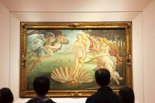 people admiring the beautiful painting of the Birth of Venus