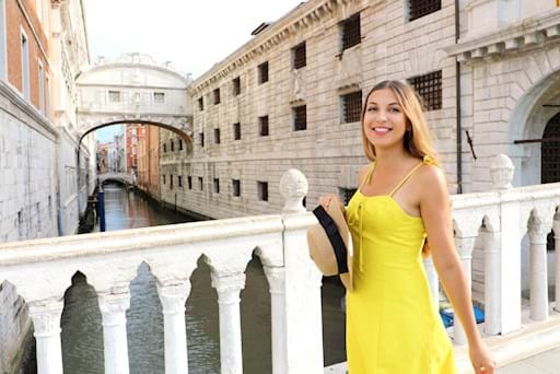 Girl visiting the Bridge of Sighs in Venice